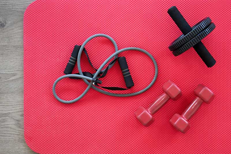 gym equipment on red mat as background top view 2023 11 27 05 24 39 utc
